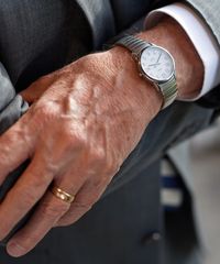 A missionary models appropriate dress and attire. He is wearing an approved wristwatch and ring.