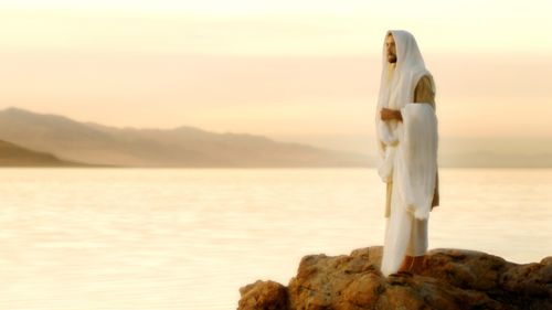 Jesus Christ standing on a rock overlooking the sea