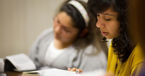 young women studying scriptures