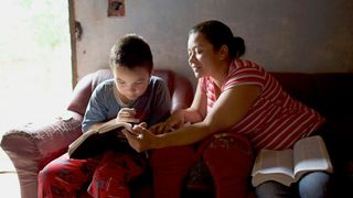 mother and son studying together