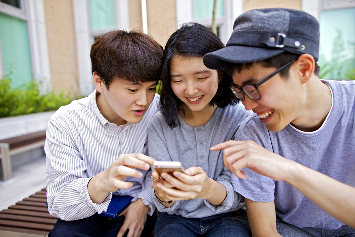 youth looking at phone