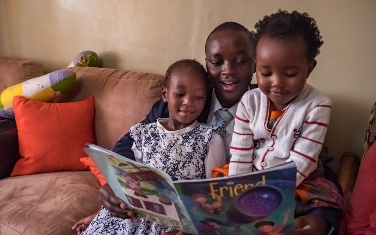 Mother reading to children.