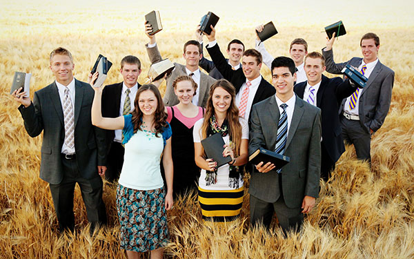 Youth holding scriptures